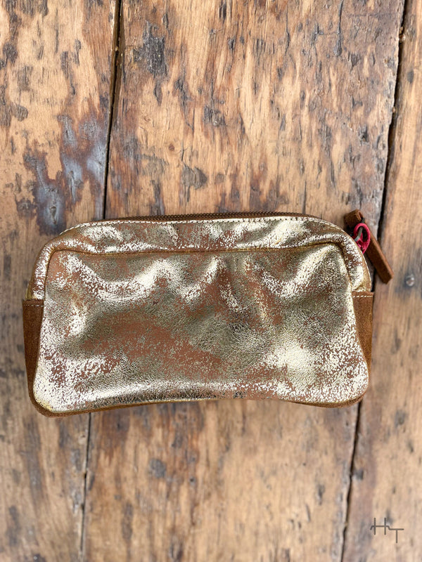 Photo of back of metallic gold leather cosmetic bag