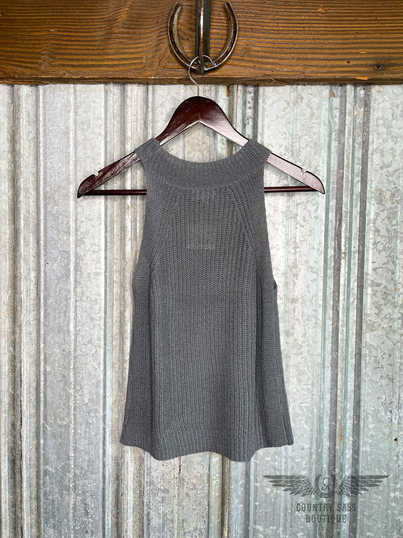 Image of the back side of dark grey tank that has a high halter neck and is made with a knit fabric.