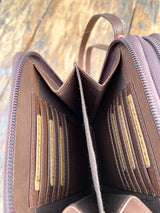 Photo of inside of zipper pocket with divider and 6 card slots on each side